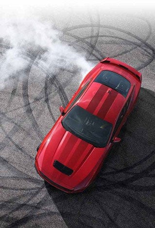 Overhead view of a 2024 Ford Mustang® model with tire tracks on pavement | Flagship Ford in Baldwin WI